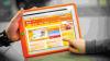 Child uses interactive British Council English games on a digital tablet